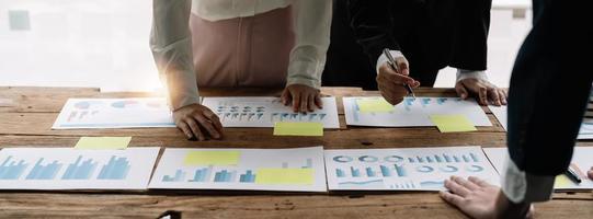 Business team working with new startup project plan and discussion for financial strategy with laptop and digital tablet in a modern business office photo