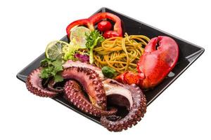 Seafood pasta with octopus and lobster leg photo