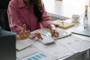 Meeting business team advisor  about charts, financial graphs showing results are analyzing and calculating planning strategies, business success building processes photo