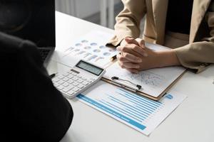 Business adviser meeting to analyze and discuss the situation on the financial report in the meeting room.Investment Consultant, Financial advisor and accounting concept photo