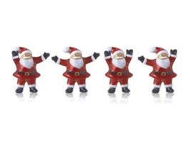 Santa claus Cute ceramic dolls statues decorations in Merry Christmas with on white background photo