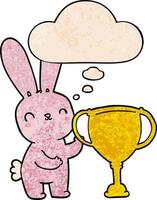 cute cartoon rabbit with sports trophy cup and thought bubble in grunge texture pattern style vector