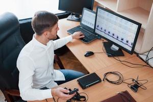 Interesting results. Polygraph examiner works in the office with his lie detector's equipment photo