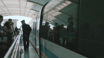Passengers board Shanghai maglev on their way to Pudong airport. video