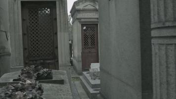 Dolly shot through Pere Lachaise Papa Lachaise cemetery in Paris France video