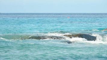 Turquoise waves rolled on the rocks, beach of Koh Miang island, Similan Islands, slow motion video