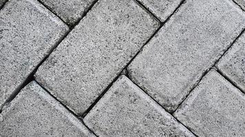 Floor motif of rectangular cement bricks for your design concept.  Geometric background pattern of rough cement floor. Paving block motif. photo