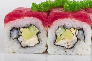 Maki Sushi - Roll made of Crab, avocado, cucumber inside. Fresh Tuna and tobico roe outside photo