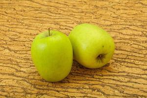 Two ripe green sweet apples photo