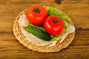 Cucumbers and tomatoes photo