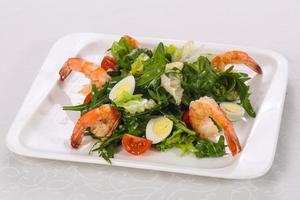 Salad with prawn, rocket and eggs photo