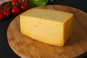 Hard yellow tasty cheese brick photo