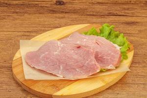 Raw pork steak for cooking photo