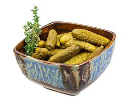 Marinated cucumbers, pickles in a bowl photo