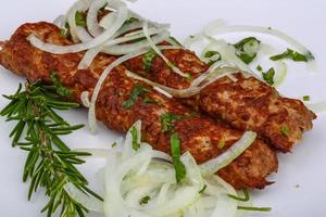 Kebab with onion rings photo