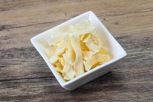 Coconut dry chips in the bowl photo