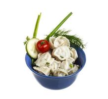 Bowl with traditional russian dish - pelmeni photo