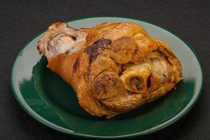 Baked pork knuckle with spices photo