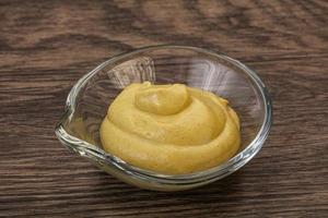 Dijon mustard sauce in the bowl photo