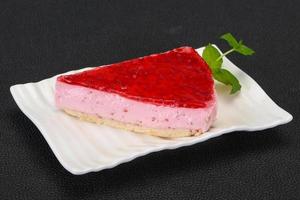 Soft Raspberry cheesecake served mint photo