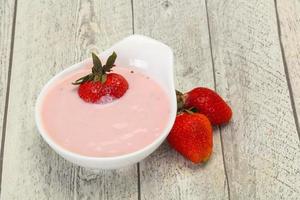 Yoghurt with strawberry in the bowl photo