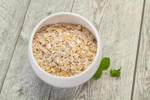 Raw oats in the bowl photo