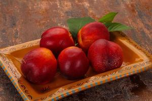 Sweet tasty ripe few nectarines photo