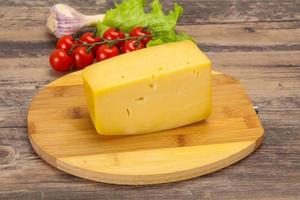 Hard yellow tasty cheese brick photo