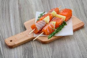 Raw salmon skewers photo