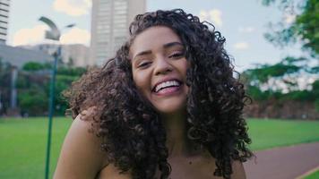 Smiling young latin woman. Joy, positive and love. Beautiful Brazilian girl. Cinematic 4K video