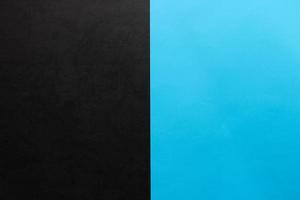 Blue and textured black paper background. Abstract banner, poster with place for text. Minimalism