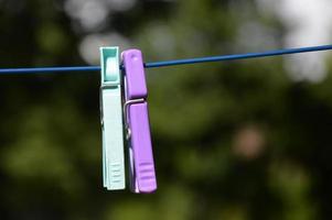 Clothespins outside on the clothesline photo