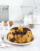 Marble Bundt Cake, Butter Cake with Vanilla and Chocolate Batter on Wooden Table photo