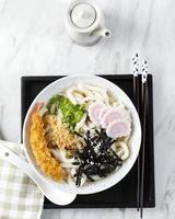 Udon with Seafood Broth, Crispy Tempura, Green Onion, and Narutomaki photo