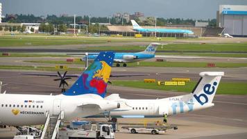 AMSTERDAM, THE NETHERLANDS JULY 29, 2017 - KLM Cityhopper Fokker 70 PH KZK taxiing before departure, Small planet Airbus A320 D ABDB, FlyBee Bombardier Dash 8 400. Schiphol Airport, Amsterdam, Holland video