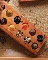 Set of Spices and herbs for cooking. Small Wooden Bowls with Colorful Seasonings and Spices. photo