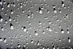 Water drops on the white surface of the car photo