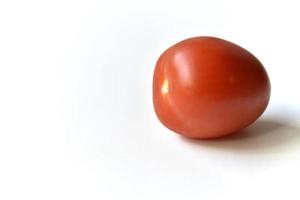 Ripe red tomatoes on a white background one and several photo