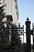 The iron fence of the government building in the park Russia. Iron pins on the fence. photo