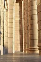 Classic yellow large building with columns in the evening photo