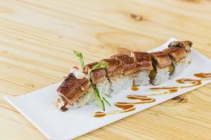 Japanese food roast eel unagi on white dish. photo