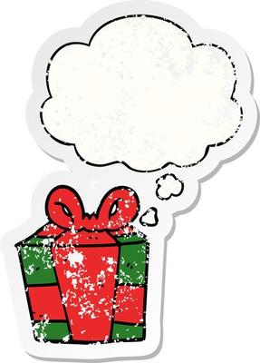 cartoon present and thought bubble as a distressed worn sticker