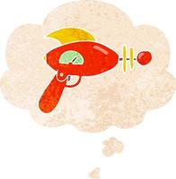 cartoon ray gun and thought bubble in retro textured style vector