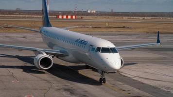 NOVOSIBIRSK, RUSSIA APRIL 14, 2018 - The aircraft Air Astana Embraer 190 P4 KCJ taxiing end after arriving at Tolmachevo Airport video