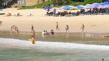 PHUKET, THAILAND NOVEMBER 15, 2017 - People relax on Nai Harn beach. This is one of the most popular beaches among tourists in Phuket