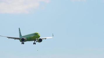 NOVOSIBIRSK, RUSSIAN FEDERATION JUNY 12, 2022 - Passenger jet plane of S7 Airlines landing at Tolmachevo airport. Cinematic footage aircraft slowly flies. Travel concept video