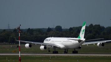 DUSSELDORF, GERMANY JULY 22, 2017 - Mahan Air Airbus 340 EP MMT accelerate before take off. Dusseldorf Airport, Germany video