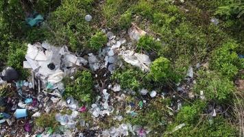 Aerial fly over rubbish thrown illegal near rural area video