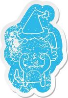 cute cartoon distressed sticker of a dog wearing santa hat vector