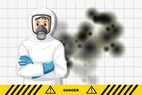 Man in protective hazmat suit with mold on the wall